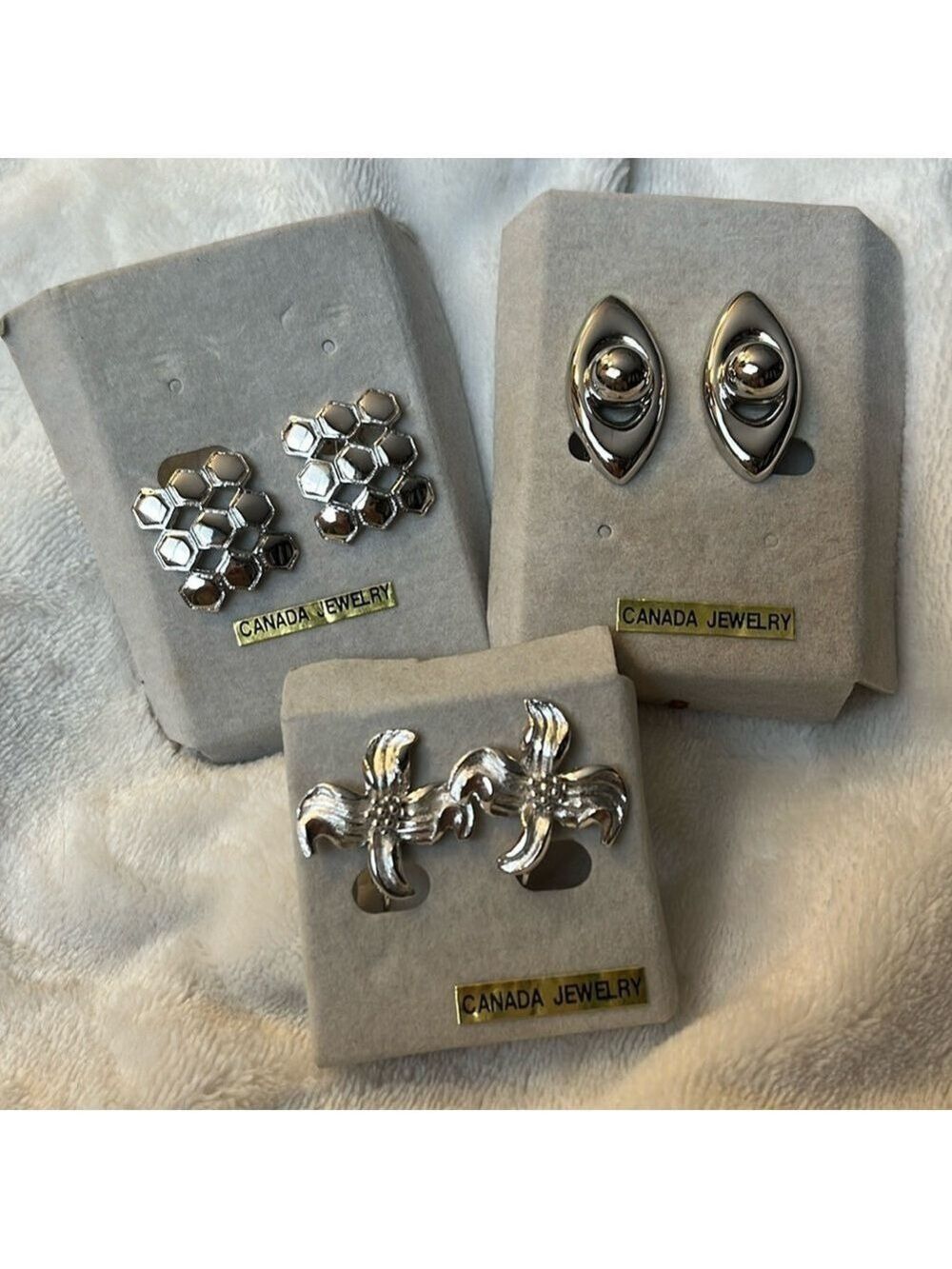 Trio of vintage D’Orlan silvertone clip on earrings